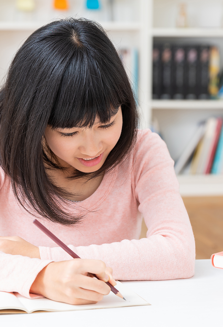 Teen girl working on LIFEPAC worktext