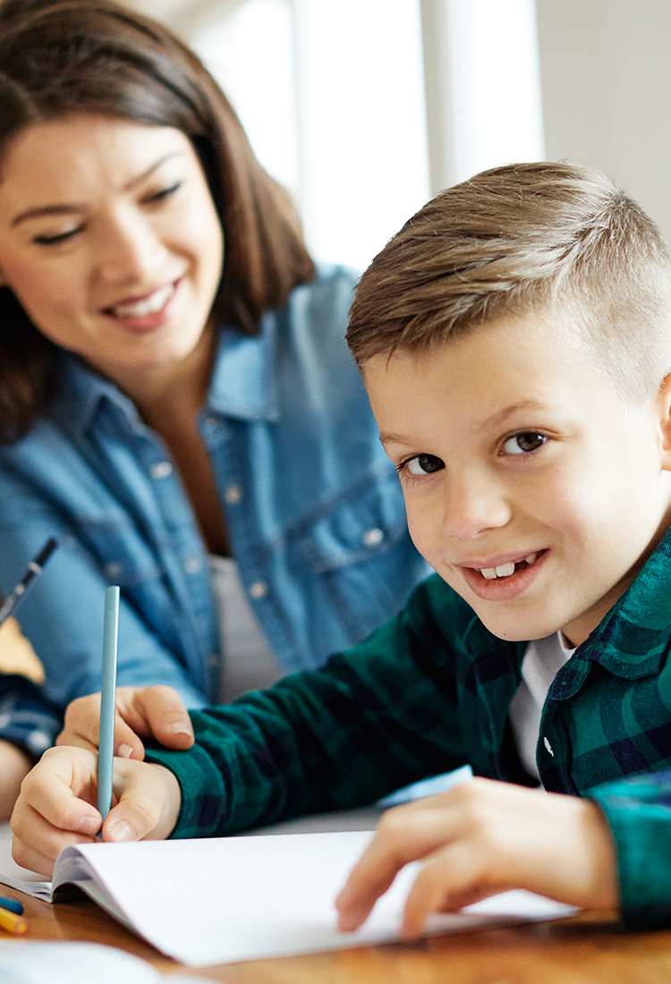 Mom and son doing schoolwork